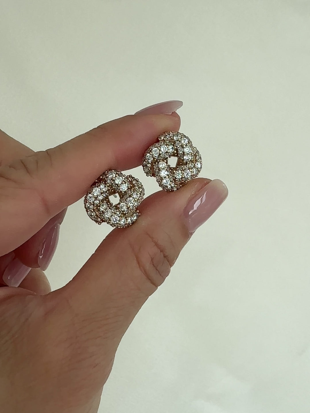 Gold stud earrings with clear gemstones